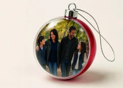 Finished red Christmas photo bauble with a family photograph inside