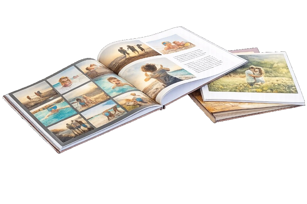 Open personalised photo book beside a closed photo book showing printed family photos