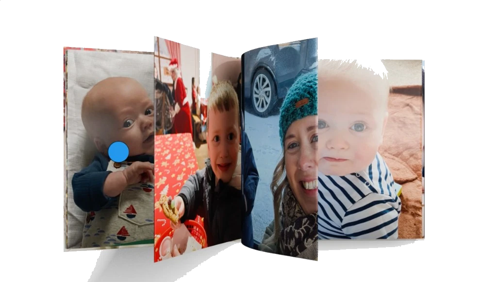 Open personalised photo book showing printed family photos across the pages